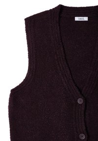 Ciemnofioletowy, bezrękawnik wykonany z teksturowanej dzianiny, z dekoltem w serek i dwoma okrągłymi guzikami z przodu. Metka: CECIL.