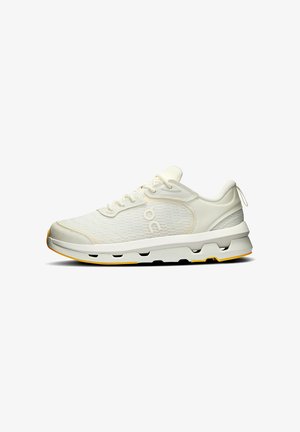 White athletic shoes with a textured mesh upper, reinforced toe cap, and yellow accents on the sole. Features a lace-up design and padded collar.