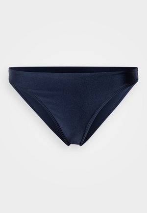 Μπλε σκούρο, μπικίνι κάτω μέρος με λεία υφή, χαμηλή μέση και μινιμαλιστικό σχέδιο. Διαθέτει διακριτικές ραφές κατά μήκος των άκρων.