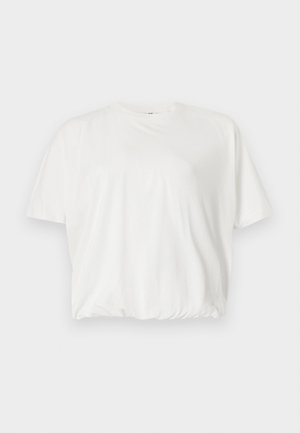 T-shirt blanc à manches courtes et coupe ample, avec encolure ronde et ourlet élastiqué, présenté sur un fond gris clair.