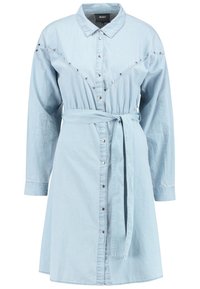 Light blue denim shirt dress, featuring a button-down front, long sleeves, waist tie, and decorative silver studs along the shoulders.