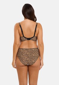 Bikini à imprimé léopard avec des bordures noires, doté de bretelles ajustables et d'une fermeture au dos. Le tissu a une texture lisse et un design ajusté.
