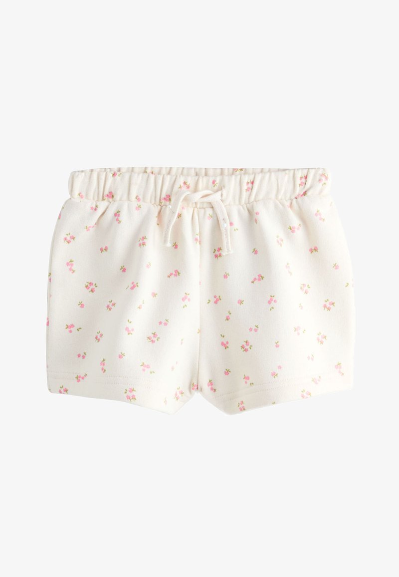 Pantalones cortos blancos con cintura elástica, pequeño estampado floral rosa y cordón frontal, diseñados para niños.