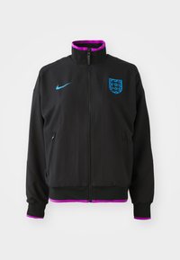 Black jacket with purple accents and high collar. Features a front zipper, side pockets, and blue Nike logo. Includes England crest design.