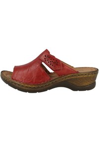 Red leather slide sandal with cutout design, textured brown platform sole, and a contoured footbed for comfort.