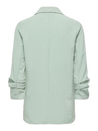 Blazer vert clair texturé avec manches longues froncées au niveau des coudes, vu de dos avec un col droit.