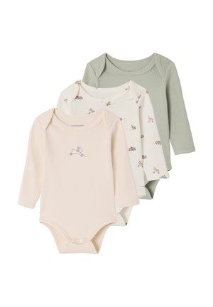 Three long-sleeve ribbed baby bodysuits in green, cream with animal print, and beige with a rabbit on wheels design.