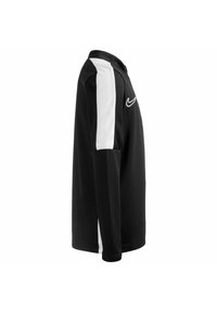 Maglietta sportiva nera a maniche lunghe con pannelli laterali bianchi e logo Nike. Presenta un colletto classico e una vestibilità strutturata. Tessuto morbido e testurizzato.
