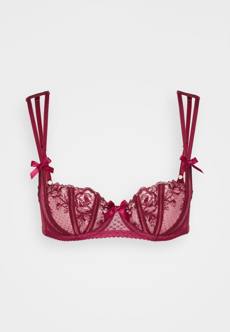 Burgundska čipkasta modrček s prosojnimi paneli, dekorativnimi pentljami na naramnicah in strukturnimi linijami. Opremljen je s cvetličnim vezenjem in satenskimi detajli.