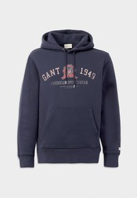 Hanorac cu glugă de culoare bleumarin, fabricat din bumbac, având un buzunar frontal, manșete ribbate și text și logo decorative în culori contrastante.