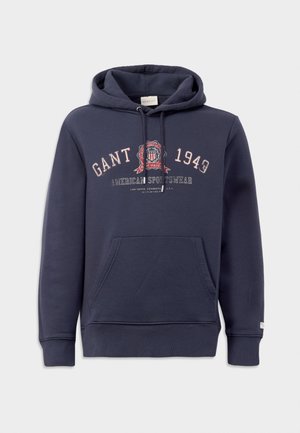 Donkerblauwe hoodie van katoen, met een voorkantzak, ribgebreide manchetten en decoratieve tekst en logo in contrasterende kleuren.