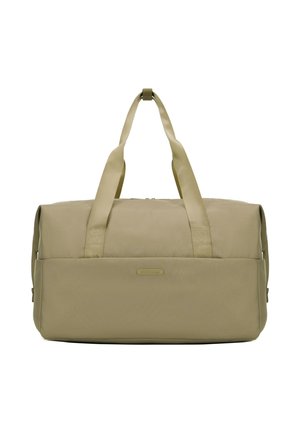 Sac de sport beige en tissu durable, avec deux poignées supérieures, une fermeture éclair et un patch logo horizontal à l'avant.