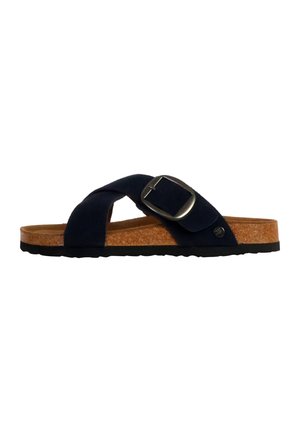 Sandale à glissière bleu marine avec des sangles croisées en daim, boucle métallique ajustable, semelle en liège et semelle extérieure en caoutchouc noir.