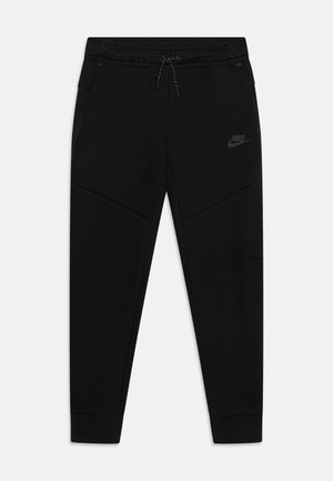 Melnas sporta bikses, kas izgatavotas no mīksta auduma, ar slīpām šuvēm, sānu kabatām un regulējamu auklu jostasvietā. Nike logos melnā krāsā.
