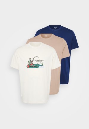 Three crew neck t-shirts: white with a printed fishing design, beige, and navy blue. Cotton material, short sleeves, casual fit.