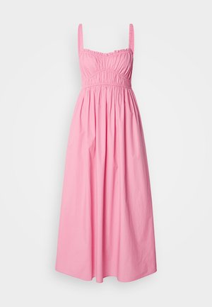 Pikk roosa kleit, mis on valmistatud puuvillast, omab volditud rinda, õhukesi õlavarre rihmasid ja voolavat seelikut, tagades mugava sobivuse.