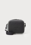 CROSSOVER UNISEX - Cross body bag - black/offwhite
