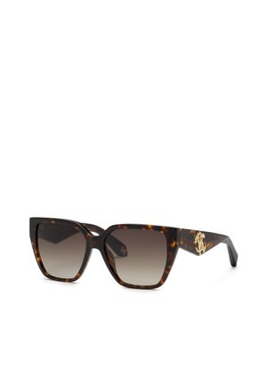 Lunettes de soleil œil de chat en écaille avec verres marron dégradés et logo décoratif doré sur la branche.