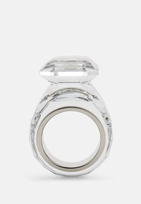 Clear acrylic ring with a large octagonal top, smooth surface, and chunky band featuring a silver inner lining.