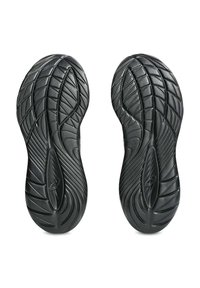 Black athletic shoe soles with a textured, leaf-like pattern and grooves for traction, featuring a streamlined oval at the center.