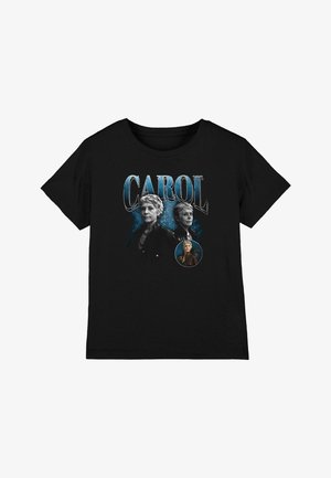 Black t-shirt with blue "CAROL" text and three images of a short-haired older woman in different poses and outfits.