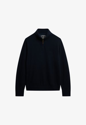 Pullover blu navy in fleece con zip a metà, dotato di un colletto alto, caratterizzato da una zip dorata e un piccolo logo ricamato sul petto. Texture liscia.