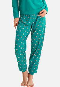 Pantalons de pyjama turquoise en matériau doux, ornés d'un motif de petits renards et de fleurs, avec une taille élastique et des jambes fuselées.