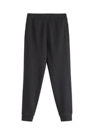 Sorte tilspidsede sweatpants med elastik i talje og manchetter, med sidelommer, lagt fladt på hvid baggrund.