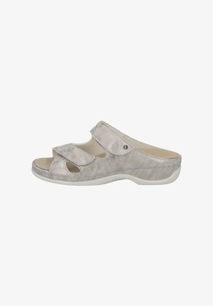 Grey suede slip-on sandals with open toe, two adjustable straps, and a white rubber sole. Features decorative cutouts and a small metal accent.