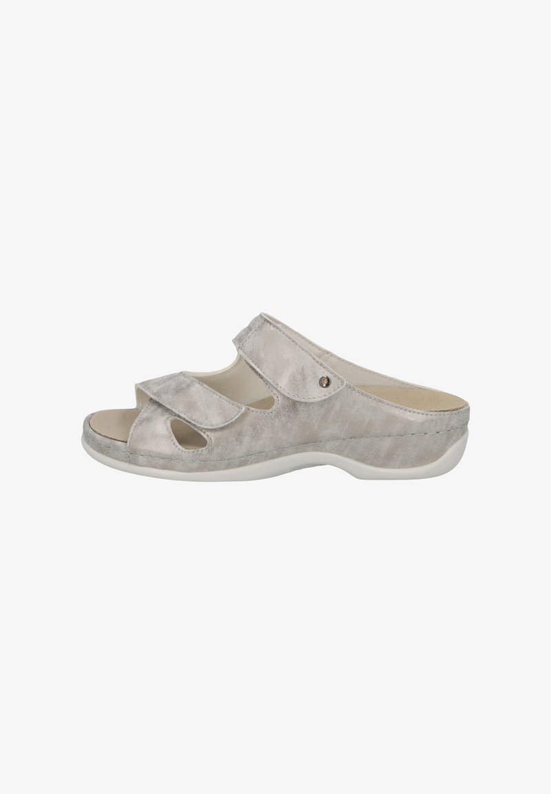 Grey suede slip-on sandals with open toe, two adjustable straps, and a white rubber sole. Features decorative cutouts and a small metal accent.