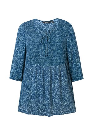 Blue floral tunic with a tie neckline, long sleeves, and elasticated bodice. The fabric features a textured pattern and a loose fit.