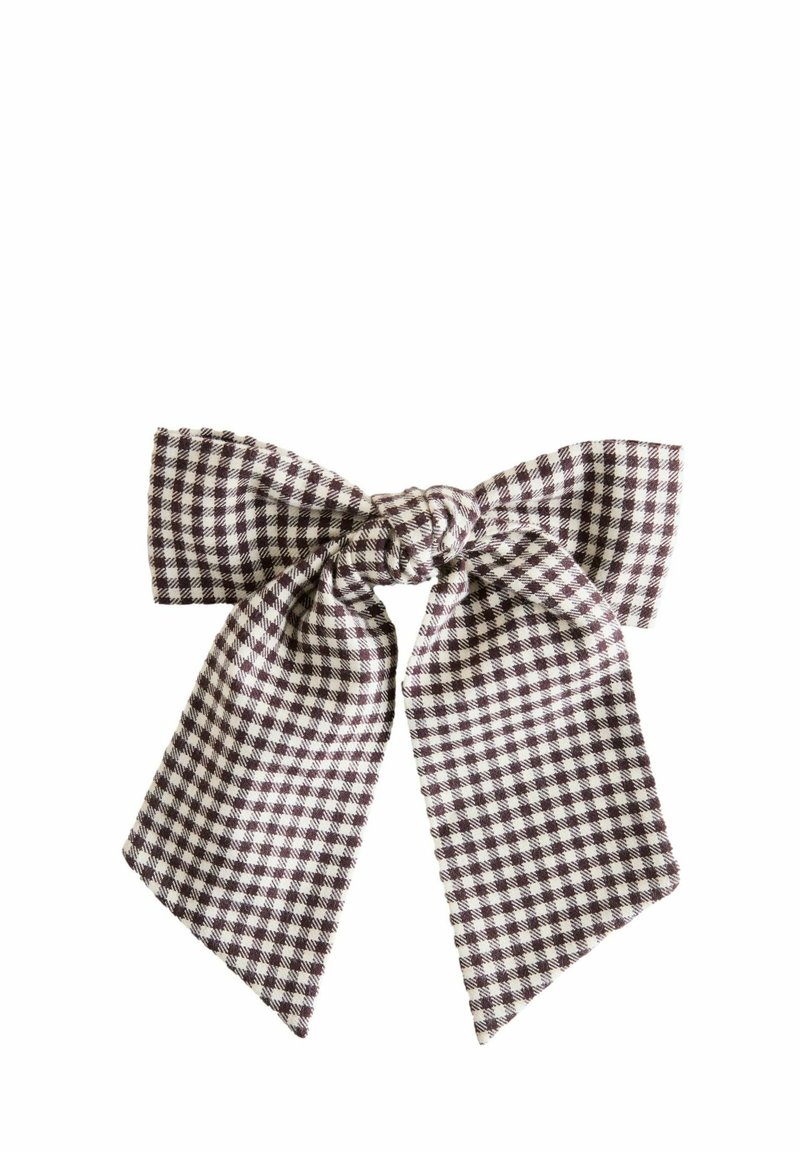 Gingham-stiilis juuksepael sõlme keskosaga, mis on kaetud pruun-valge ruudustikuga. Kangas on sileda tekstuuriga, laiade ja sümmeetriliste sabadega.