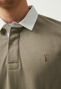 Next Pólóing - neutral brown