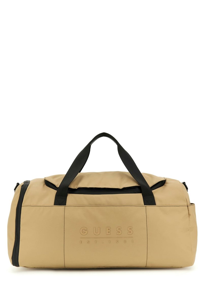 Beige Reisetasche aus Nylon mit schwarzen Akzenten, ausgestattet mit einem Frontlogo, zwei oberen Griffen und einem Reißverschluss-Hauptfach.