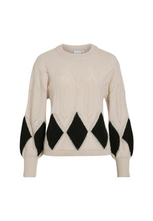 Jersey de punto beige con patrón de diamante en negro en la mitad inferior, con mangas abullonadas y puños y dobladillo acanalados.