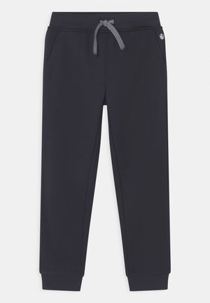 Mørkeblå joggebukser med ribbenmanchetter, forlommer og en hvidstribet snor i den elastiske talje.