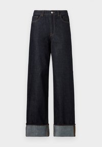 Mørkeblå denimjeans med vide ben, rullede bærestropper i lysere denim, kobberbroderi, fem lommer og knaplukning.