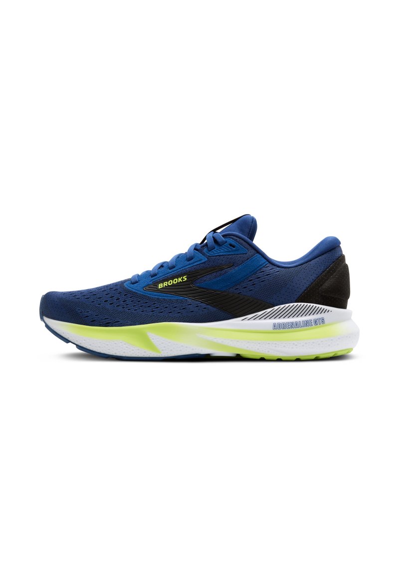 Scarpa sportiva blu con tomaia in rete, accenti neri e intersuola verde brillante. Presenta una punta arrotondata e una suola bianca imbottita con grip.
