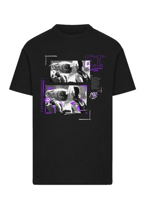 Black cotton t-shirt featuring a graphic print of alien-like figures in grayscale, accented with purple text and various abstract designs.