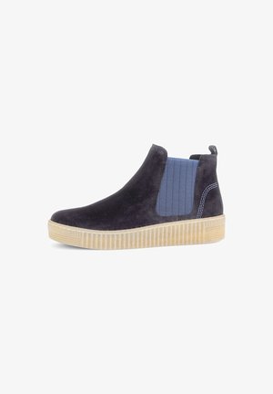 Suede ankle boots in navy with elastic side panels in a herringbone pattern, beige rubber sole with textured grooves.