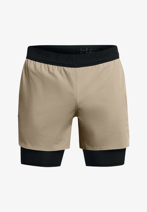 Beežid spordilühikesed püksid musta elastse vöökohtaga, mille all on integreeritud must kompressioonikiht. Sile tekstuur, minimalistlik disain.