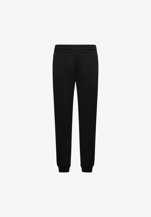 Pantalones de chándal negros hechos de una tela suave, con un diseño de pierna ajustada, cintura elástica y puños acanalados en los tobillos.