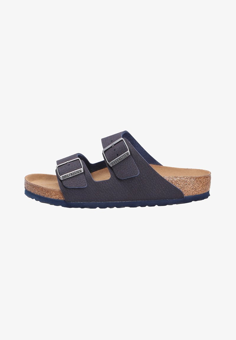 Navy blue two-strap sandal with buckles, made from textured synthetic material. Features a brown cork footbed and a rubber outsole.