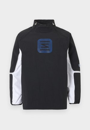 Veste noire à manches longues avec des panneaux blancs sur les manches, col montant avec boutons-pression et logo géométrique bleu centré sur la poitrine.
