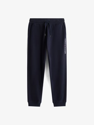 Marineblå afslapningsbukser med elastisk talje, snor og tapered ben. Har hvid 'TOMMY HILFIGER' logo langs venstre side.