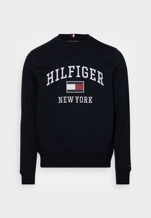 Black crewneck sweatshirt with "HILFIGER" and "NEW YORK" text and a red, white, and black rectangular logo centered on the chest.