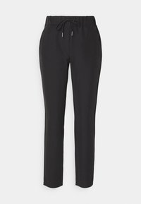 Schwarze, schmal zulaufende Hose aus weichem Stoff, mit einem elastischen Bund und Kordelzug sowie seitlichen Taschen für Funktionalität.
