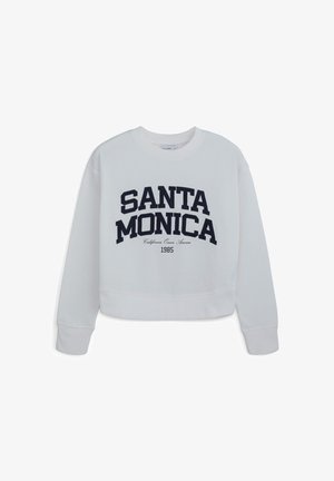 Sweatshirt court blanc avec "SANTA MONICA" en lettres navy audacieuses. Tissu doux avec un col rond et des poignets côtelés.
