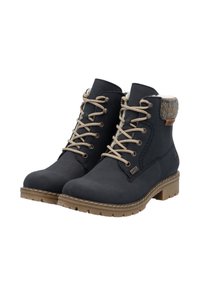 Bottines bleu foncé en cuir lisse, avec des lacets beiges, un bord en tricot et une semelle en caoutchouc avec un léger talon.