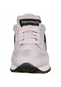 Light pink sneaker with black accents, suede and mesh materials, flat laces, padded tongue, and a textured black rubber sole.